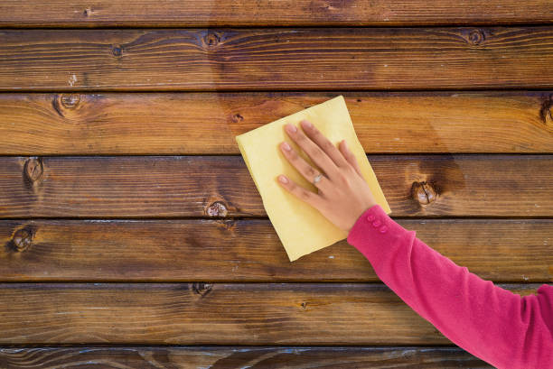 woman hand cleaning wooden surface